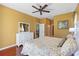 This is the main bedroom with a king bed that includes a ceiling fan and hardwood floors at 1567 Monarch Dr, Venice, FL 34293