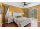 This is the main bedroom with a king bed that includes sliding glass doors and hardwood floors at 1567 Monarch Dr, Venice, FL 34293