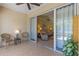 Enclosed patio providing access to the main house and backyard with lush landscaping at 1567 Monarch Dr, Venice, FL 34293