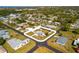Aerial view of the property showcasing its location within a quiet neighborhood at 1600 Maryknoll Rd, Englewood, FL 34223