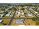 Neighborhood aerial view of the home shows proximity to waterways and roadways at 1600 Maryknoll Rd, Englewood, FL 34223