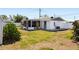 A cozy screened lanai and spacious yard defines this charming home's backyard at 1600 Maryknoll Rd, Englewood, FL 34223