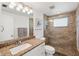 Bathroom featuring a shower with decorative tiled walls and granite countertop at 1600 Maryknoll Rd, Englewood, FL 34223