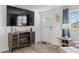 Inviting entryway featuring a modern console with fireplace and stylish decor at 1600 Maryknoll Rd, Englewood, FL 34223