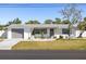 Charming single-story home with a well-manicured front yard and inviting curb appeal at 1600 Maryknoll Rd, Englewood, FL 34223