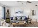 Living room with couch, decorative pillows, and coastal-inspired decor at 1600 Maryknoll Rd, Englewood, FL 34223