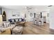 Open-concept living room and kitchen with bar seating and modern finishes at 1600 Maryknoll Rd, Englewood, FL 34223