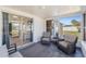 Enclosed sun room with wicker furniture, large windows, and view of the yard at 1600 Maryknoll Rd, Englewood, FL 34223