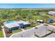 A high angle displays the community pool with a clubhouse, playground and parking lot at 16258 Hidden Oak Loop, Bradenton, FL 34211