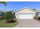 Charming single Gathering home with a brick paver driveway, well manicured lawn and two car garage at 1627 Lancashire Dr, Venice, FL 34293