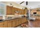 Modern kitchen featuring stainless steel appliances, granite countertops and custom cabinetry at 1627 Lancashire Dr, Venice, FL 34293