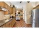 Well-equipped kitchen featuring stainless steel appliances and an adjacent cozy breakfast nook at 1627 Lancashire Dr, Venice, FL 34293