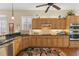 Stylish kitchen featuring granite countertops, stainless steel appliances and plenty of cabinet space at 1627 Lancashire Dr, Venice, FL 34293