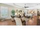Well-lit living area boasts a large window, hardwood floors, and inviting furnishings at 1627 Lancashire Dr, Venice, FL 34293