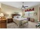 Cozy main bedroom featuring natural light, carpet floors, and comfortable furnishings at 1627 Lancashire Dr, Venice, FL 34293