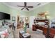 Charming office area with a ceiling fan, comfortable seating, and serene green walls at 1627 Lancashire Dr, Venice, FL 34293