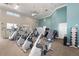 A modern gym boasts up-to-date equipment and plenty of space for working out at 1717 Dogleg Dr, Venice, FL 34285