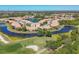 Aerial view of homes nestled around scenic ponds and golf course, showcasing community layout at 1853 San Silvestro Dr, Venice, FL 34285