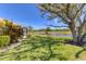 Beautiful backyard with a view of the pond, complemented by lush green grass at 1853 San Silvestro Dr, Venice, FL 34285