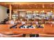 Close up view of an elegant bar with dark wood accents, stocked shelves and glassware at 1853 San Silvestro Dr, Venice, FL 34285