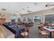 Bright and airy dining space with large windows and plenty of seating for patrons to relax and socialize at 1853 San Silvestro Dr, Venice, FL 34285