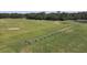 Aerial view of golfers practicing on the driving range at 1853 San Silvestro Dr, Venice, FL 34285