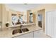 Spacious kitchen with eat-in counter open to the formal dining room at 1853 San Silvestro Dr, Venice, FL 34285