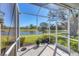 Relax on screened lanai with serene views of lake and landscape at 1853 San Silvestro Dr, Venice, FL 34285
