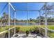 Screened lanai boasts beautiful views of the pond and greenery at 1853 San Silvestro Dr, Venice, FL 34285