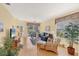 Comfortable living room with wood floors, ceiling fan and water view at 1853 San Silvestro Dr, Venice, FL 34285