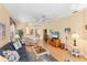 Inviting living room with comfortable seating and hardwood floors offers a welcoming space at 1853 San Silvestro Dr, Venice, FL 34285
