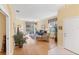 Open-concept living room features wood floors and lots of natural light at 1853 San Silvestro Dr, Venice, FL 34285