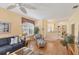Cozy living room with a blue sofa, wicker chair and hardwood floors offers a comfortable space at 1853 San Silvestro Dr, Venice, FL 34285