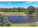 Scenic view of the pond and golf course from this home at 1853 San Silvestro Dr, Venice, FL 34285