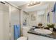 Bathroom featuring a glass shower, toilet, sink with granite countertop, mirror, and light fixture at 200 Park N Blvd # 108, Venice, FL 34285