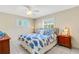 Charming bedroom with bedside tables and beach-themed decor at 200 Park N Blvd # 108, Venice, FL 34285