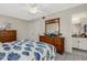 Well-lit bedroom with a dresser and an ensuite bathroom at 200 Park N Blvd # 108, Venice, FL 34285
