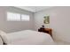 Bedroom featuring a desk and chair, window with white blinds, and queen bed at 200 Park N Blvd # 108, Venice, FL 34285