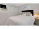 Bedroom with a queen bed, two nightstands, and built-in white closet doors at 200 Park N Blvd # 108, Venice, FL 34285