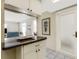 Pass-through kitchen with granite counters offers views to the living room with ample light at 200 Park N Blvd # 108, Venice, FL 34285