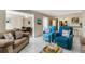 Comfortable living room with stylish seating, with an opening into the dining room at 200 Park N Blvd # 108, Venice, FL 34285