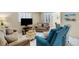 Inviting living room with comfortable seating, a large window, and stylish decor at 200 Park N Blvd # 108, Venice, FL 34285