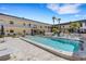 Relaxing pool area with lounge chairs, creating a vacation vibe at 200 Park N Blvd # 108, Venice, FL 34285
