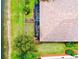 Birds-eye view of the property, showcasing the yard, tile roof, and pond at 20176 Tesoro Dr, Venice, FL 34293