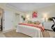 Inviting bedroom with white bedding, decorative accents, and a bright, airy feel at 20176 Tesoro Dr, Venice, FL 34293