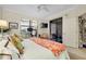 Relaxing bedroom with a view to the outdoor patio and a dedicated workspace at 20176 Tesoro Dr, Venice, FL 34293