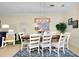 Cozy dining area with a spacious table, comfortable chairs, and stylish overhead lighting at 20176 Tesoro Dr, Venice, FL 34293