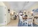 Open concept dining room with modern lighting, tile floors, and a view of the living area at 20176 Tesoro Dr, Venice, FL 34293