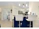 Bright kitchen with breakfast bar seating and modern appliances at 20176 Tesoro Dr, Venice, FL 34293