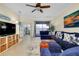 Spacious living room with comfortable blue sectional couch and stylish decor at 20176 Tesoro Dr, Venice, FL 34293